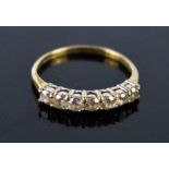 A 9ct gold ring set with seven brilliant cut stones, size P.