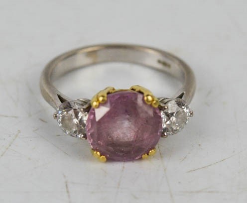 An 18ct white gold, pink sapphire and diamond ring, each diamond approximately 0.6ct, size S, 6.6g.