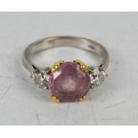 An 18ct white gold, pink sapphire and diamond ring, each diamond approximately 0.6ct, size S, 6.6g.