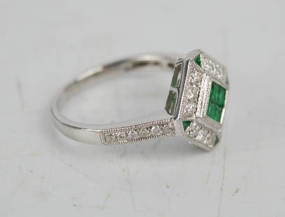 An 18ct white gold, emerald and diamond Art Deco style ring, with four brilliant cut emeralds, - Image 3 of 3