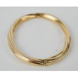 A gold bracelet, twisted form, 18.6g.