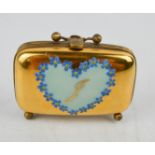 A vintage gilt metal trinket box painted with forget-me-nots and the letter J.