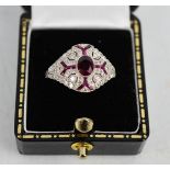 A ruby, diamond Art Deco style ring, size N, 5g, (un-hallmarked, tested as 18ct white gold).
