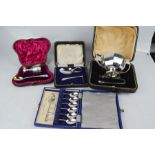 A silver Christening sets and spoons, egg cup London 1924, twin handled sugar bowl and nips