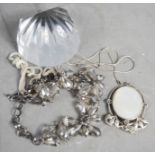 A Stuart crystal paperweight, a silver necklace, a silver and mother of pearl pendant, a crystal