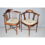 Two Edwardian mahogany marquetry armchairs.