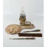 A silver dressing table set, comprising hand mirror, nail buffer, button hook, comb and nail file,