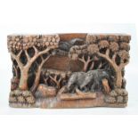 An African relief carving, depicting elephants beneath a canopy of trees, 16 by 25cm.