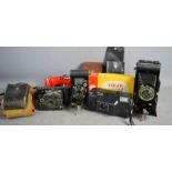A Vintage Six-20 folding brownie, boxed, two 1980s examples, a Kodak no 127 and an Eastman Kodak