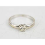 An 18ct white gold and diamond solitaire ring, size N, 3.1g.