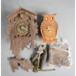 A cuckoo clock, and a clock in the form of an owl.