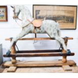 A hand painted rocking horse. 112cm h