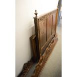 A French Breton double bed, 19th century, with carved back and end boards.