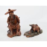 A Chinese carved figure and water buffalo.