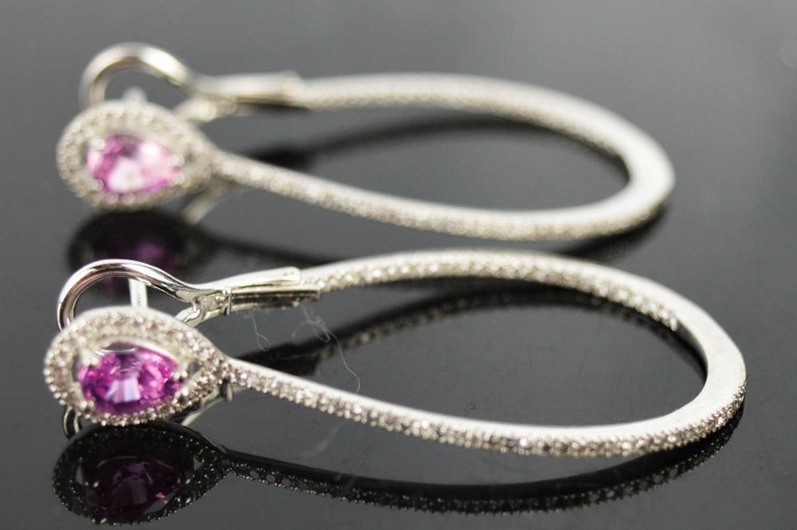 A pair of 18ct white gold and pink sapphire and diamond hoop earrings, with pear shaped pink