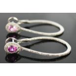 A pair of 18ct white gold and pink sapphire and diamond hoop earrings, with pear shaped pink