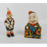 Two vintage cast iron money boxes, one Humpty Dumpty and one clown example, hand painted with