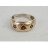 A 9ct white gold and garnet set ring, size Q, 4.6g.
