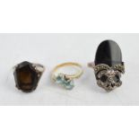 Two silver and one yellow metal ring, one Art Deco style in jet, one with smoky quartz and one