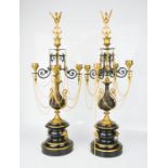 A fine pair of French ormolu Empire candelabra, with bird form finials, bronze scrollwork branches