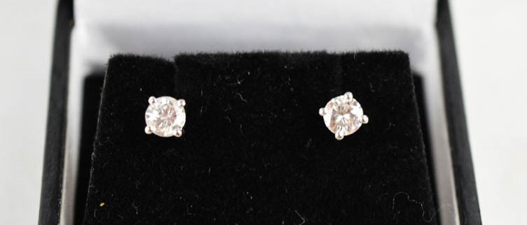 A pair of platinum brilliant cut diamond studs,