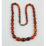 An amber necklace, composed of clear graduated beads, 17.8g.