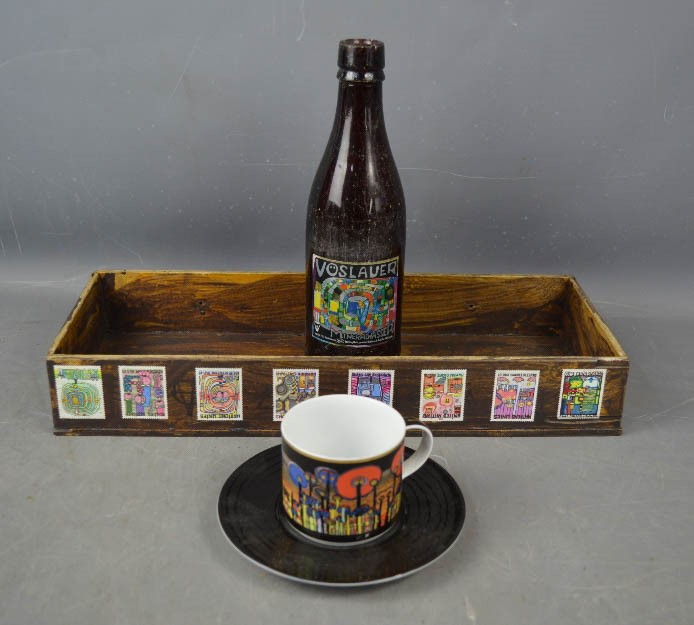 A Hundertwasser design box, bottle, cup and saucer.