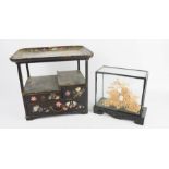 A Chinoiserie black lacquered and mother of pearl inlaid display table cabinet together with a