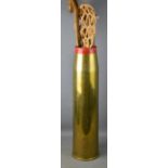 A large brass military shell casing, 65.5cm high.