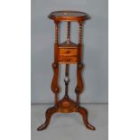 A mahogany jardiniere stand with two drawers, 86cm high.