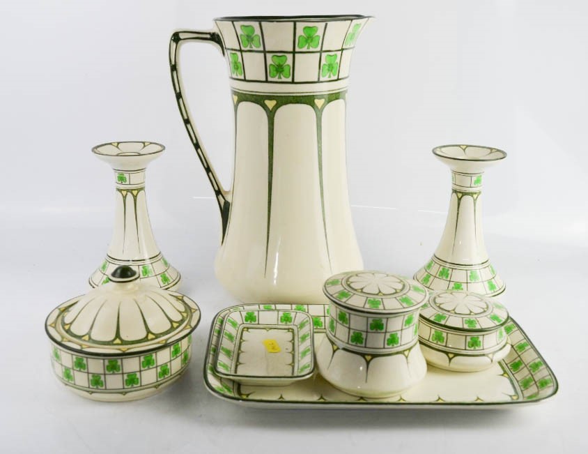 A Royal Doulton part dressing table set in the clover leaf pattern, including jug, candlesticks,