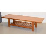 A mid century coffee table, 30 by 122 by 38cm.
