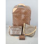 A group of Louis Vuitton style items to include two handbags, purse and suitcase.