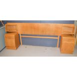 A G-Plan double bed head board, and two matching bedside cabinets.