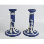 A pair of Adams Tunstall blue Jasper ware candlesticks. 18cm high.