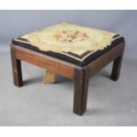 A 19th century oak stool with needlework drop in seat.