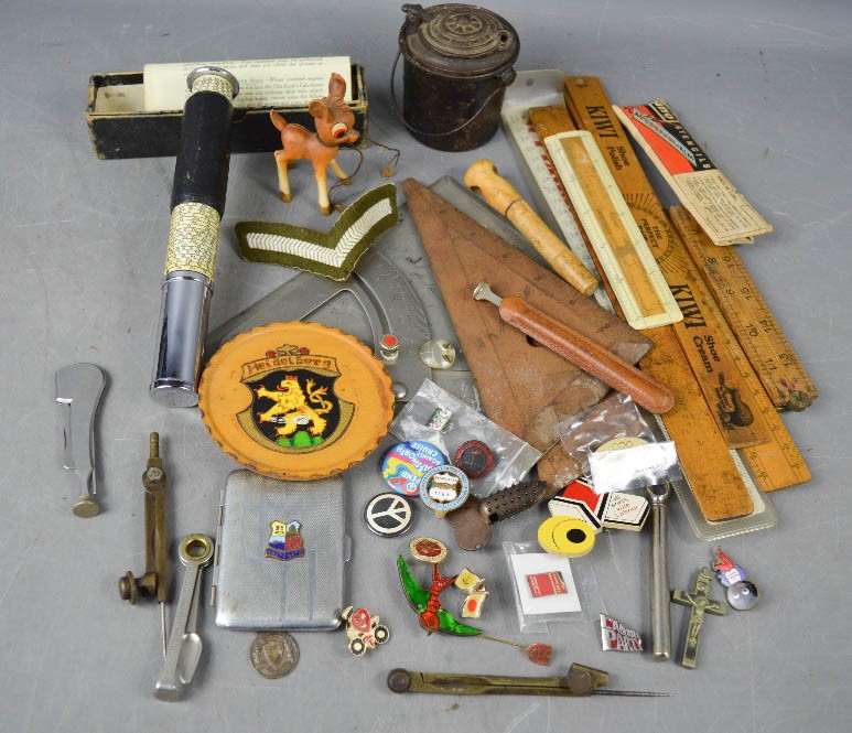 A group of collectables, including silver pendant, vintage rulers, Otis king calculator, pipe