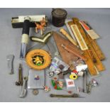 A group of collectables, including silver pendant, vintage rulers, Otis king calculator, pipe