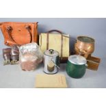 A group of items to include leather bag, bowling balls, and other items.