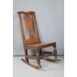 A late 18th/ early 19th century rocking chair.