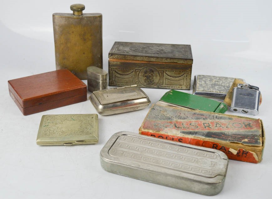 A group of collectables, including boxed rolls razor, cigarette tins, petrol lighters, flask.