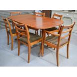 A Mcintosh dining table, with six matching dining chairs.