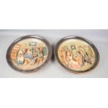 A pair of Musterschutz relief moulded chargers, impressed to the base JM8 5234, terracotta and