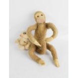 An early 20th century toy monkey, and another example.