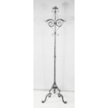 A cast iron floor standing candle stand.