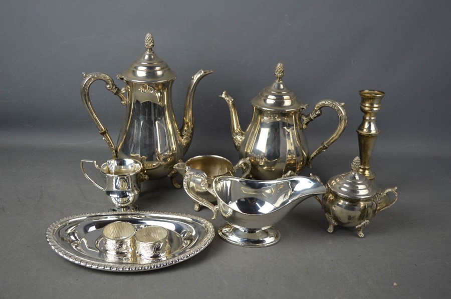 A tray of silver plate ware and other items including candlestick.