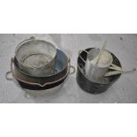 A group of enamel and galvanised buckets and galvanized watering can.