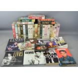A quantity of Elvis memorabilia, VHS tapes, together with nine Elvis collectors books; Elvis '