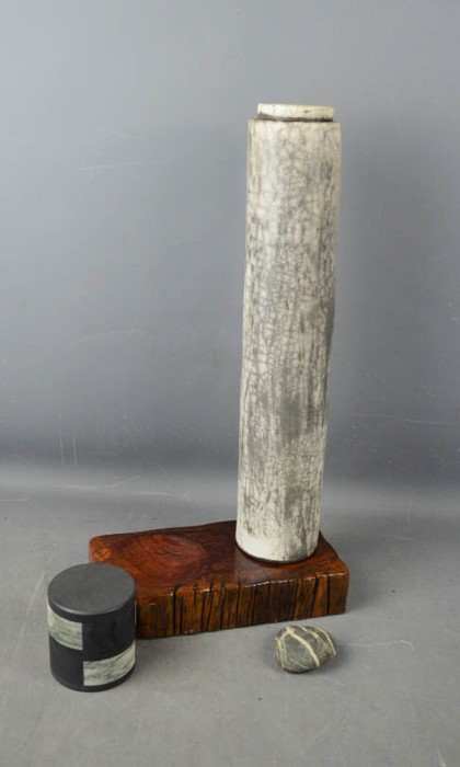 A Raku vessel with stand, by Inger Rokkjaer, with small jar and cover.