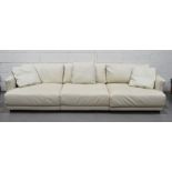 A four seater leather settee.